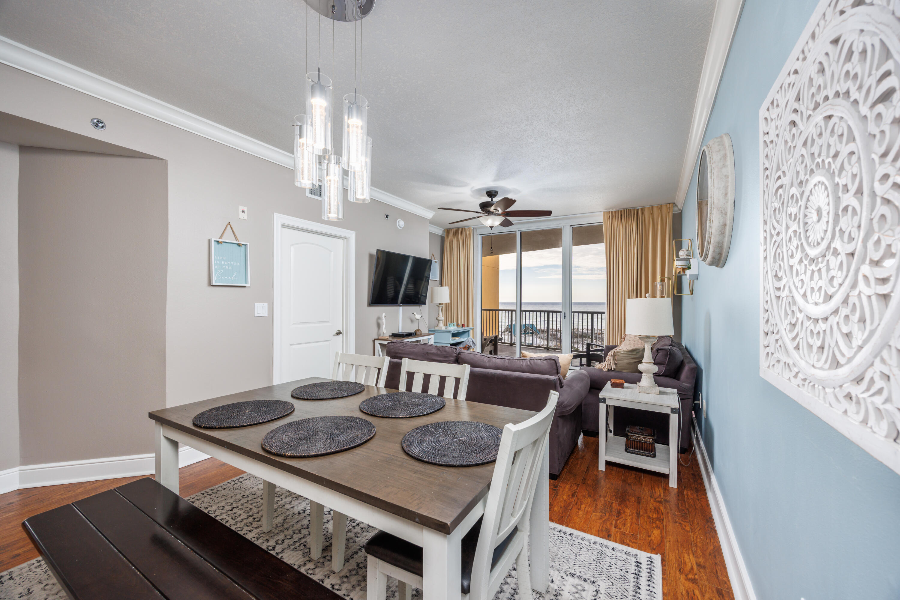 1150 Santa Rosa Boulevard, Unit 421 Fort Walton Beach, FL 32548 - Photo 5 of 46 a view of a dining room with furniture window and wooden floor