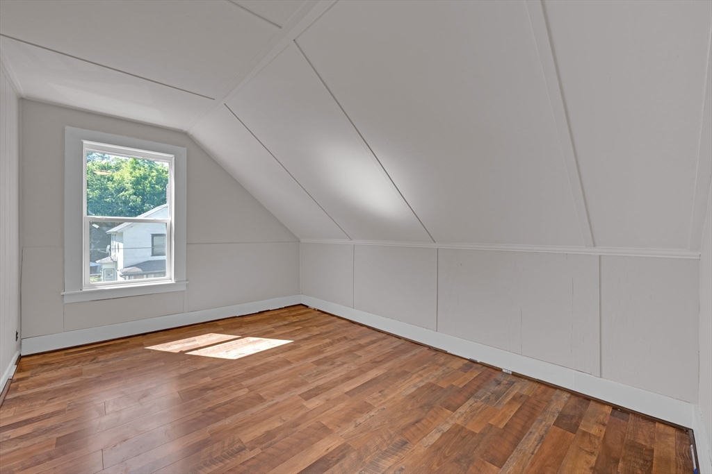 47 Morris Street Southbridge, MA 01550 - Photo 20 of 40 an empty room with wooden floor and windows