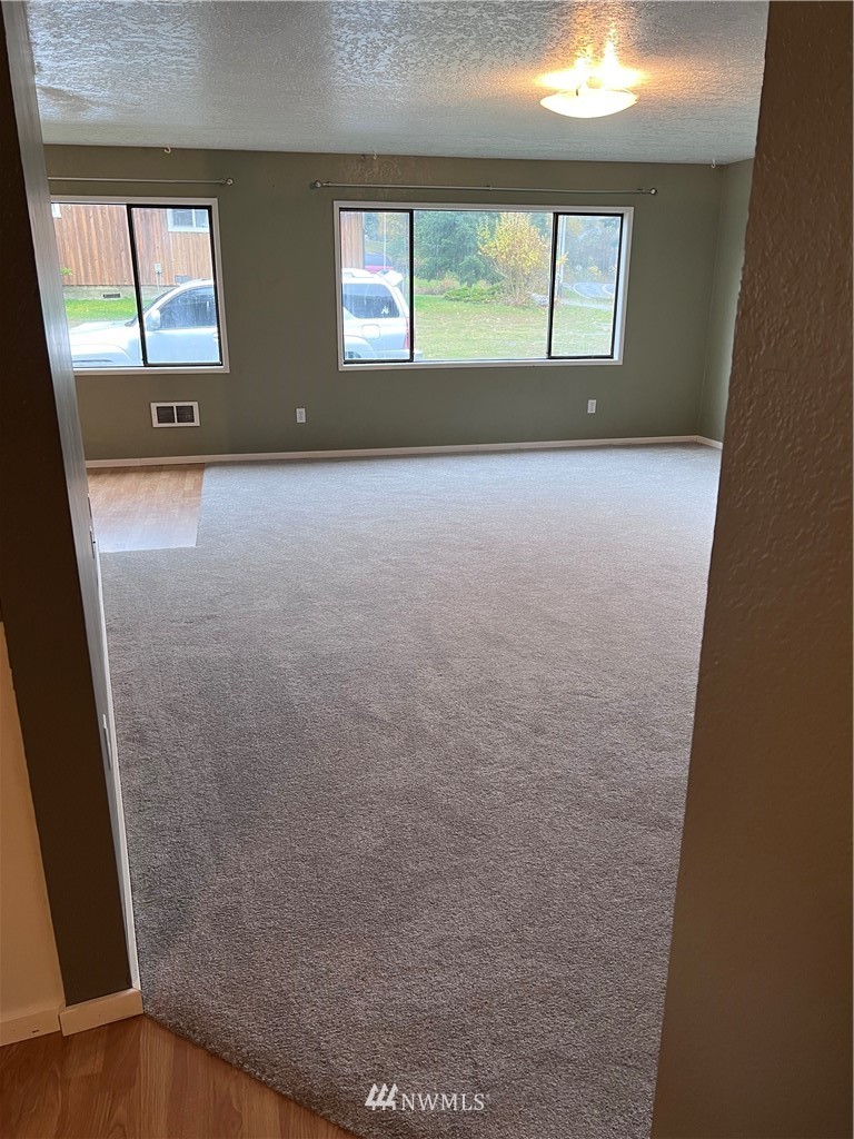 2163 O Brien Road Port Angeles, WA 98362 - Photo 3 of 24 view of empty room with windows