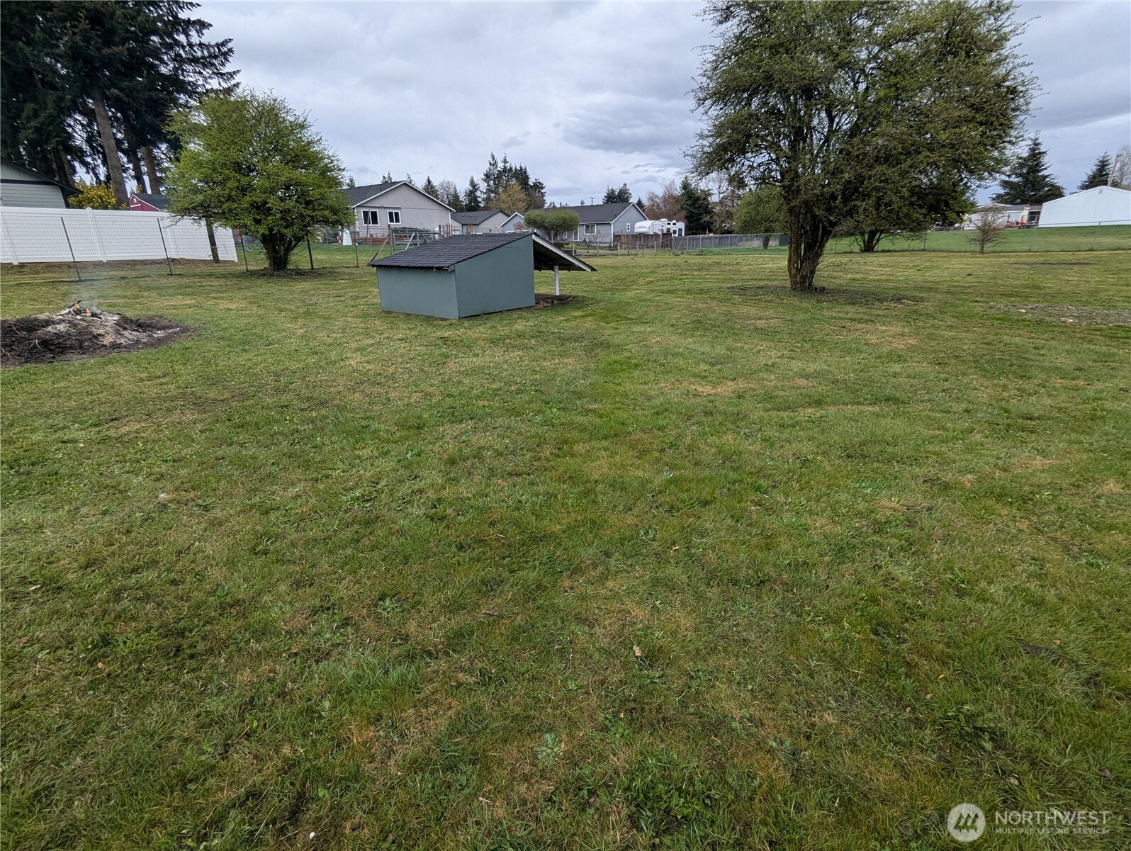 17907 Jordan Street Southwest Rochester, WA 98579 - Photo 28 of 28 a backyard of a house with plants and trees
