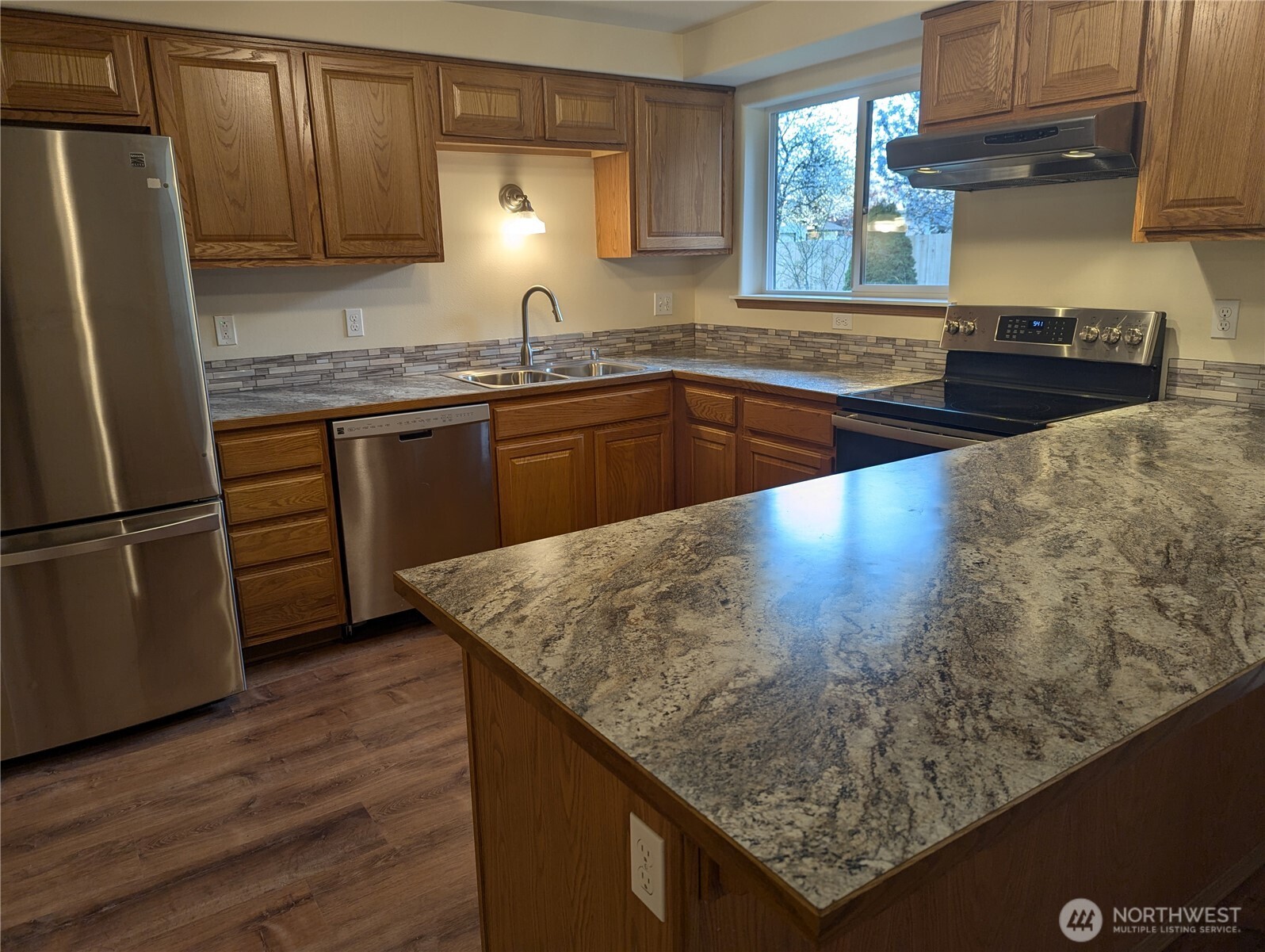 17907 Jordan Street Southwest Rochester, WA 98579 - Photo 8 of 28 a kitchen with stainless steel appliances granite countertop a sink stove and refrigerator