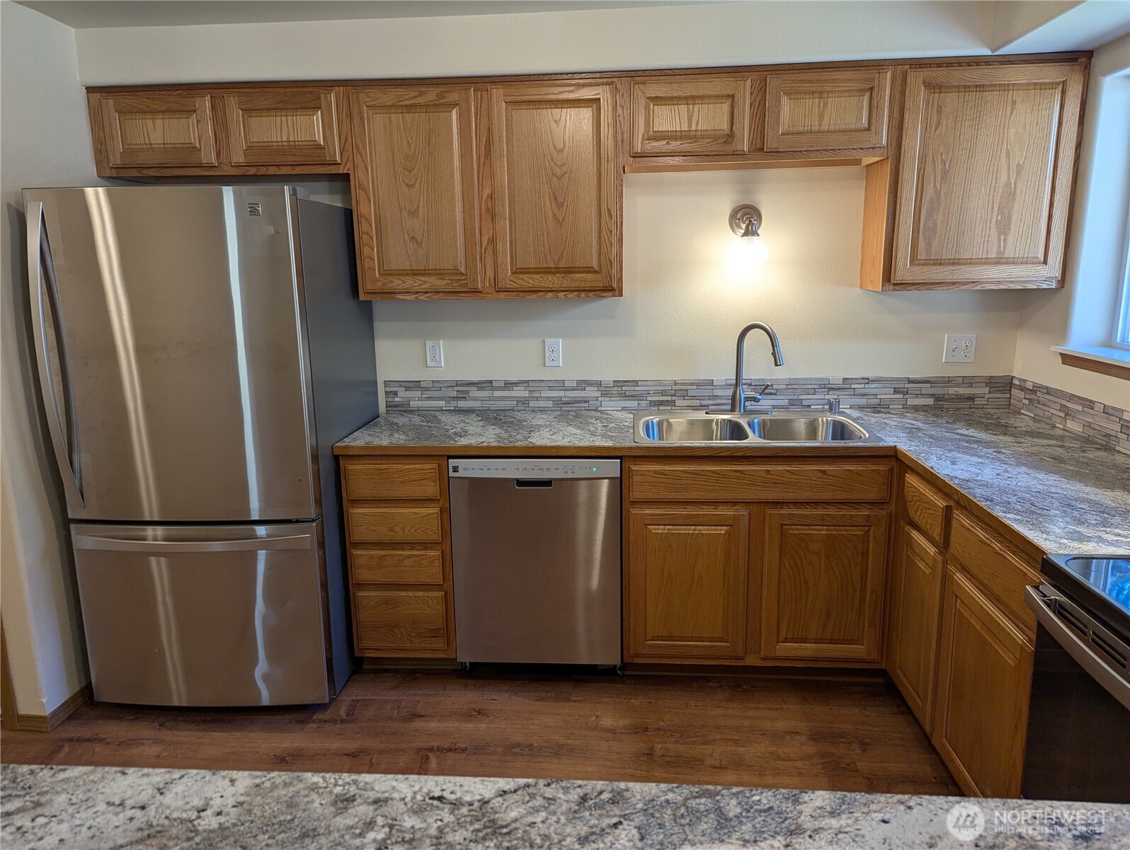 17907 Jordan Street Southwest Rochester, WA 98579 - Photo 10 of 28 a kitchen with stainless steel appliances granite countertop a refrigerator sink and cabinets