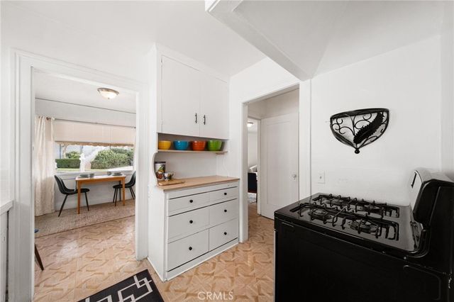 a kitchen with a stove and a refrigerator