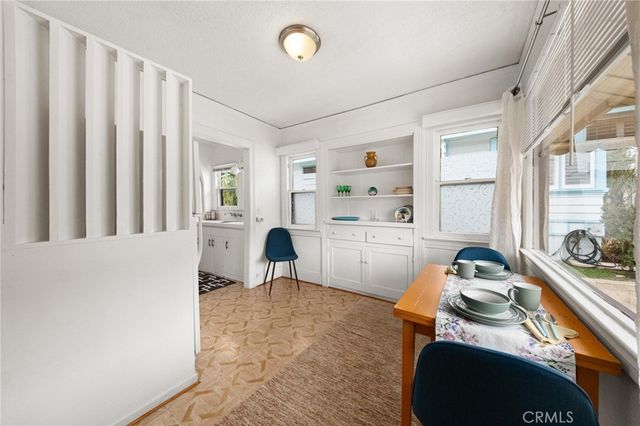 a workspace with furniture and window