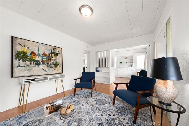 a living room with furniture and a lamp