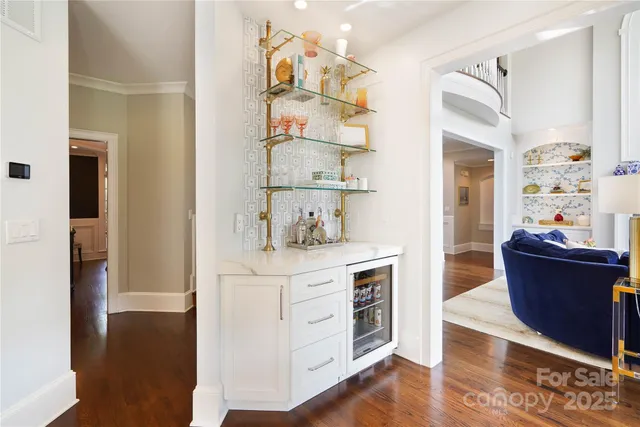 a view of kitchen with stainless steel appliances cabinets and wooden floor