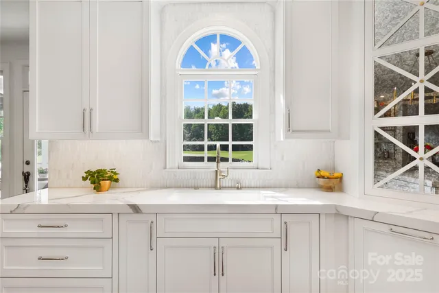 a kitchen with a sink and a window