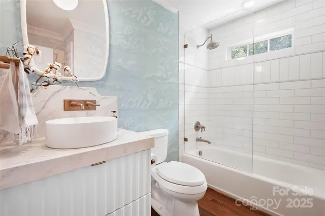 a bathroom with a sink a toilet and a bathtub