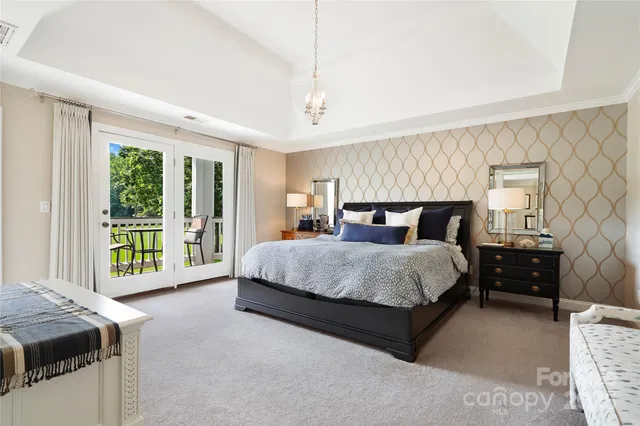 a bed room with a bed and a tv