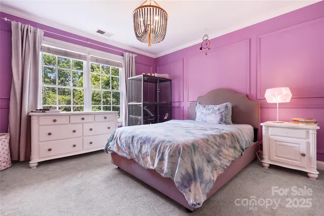 a bedroom with a bed closet and window