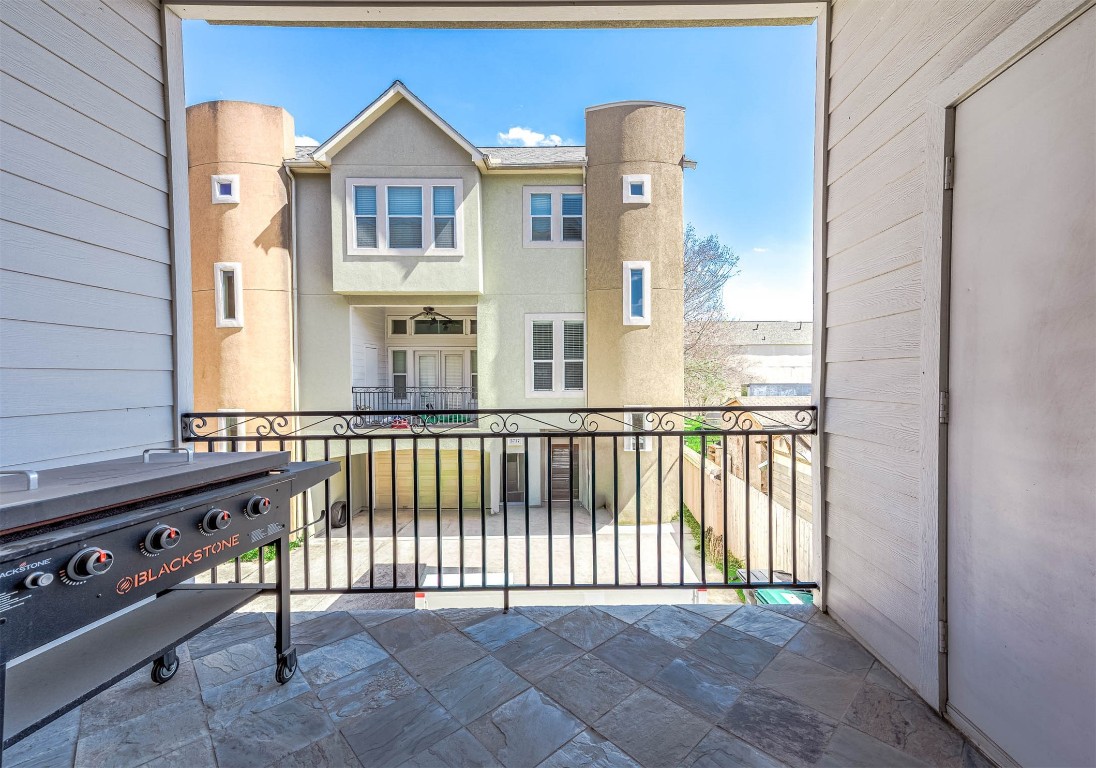5723 Petty Street Houston, TX 77007 - Photo 21 of 31 a view of a balcony with wooden fence