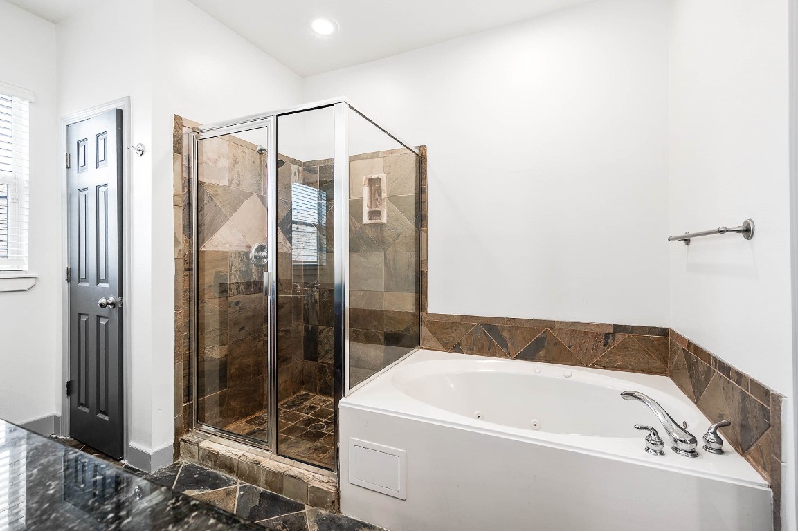 5723 Petty Street Houston, TX 77007 - Photo 30 of 31 a bathroom with a white bath tub and shower