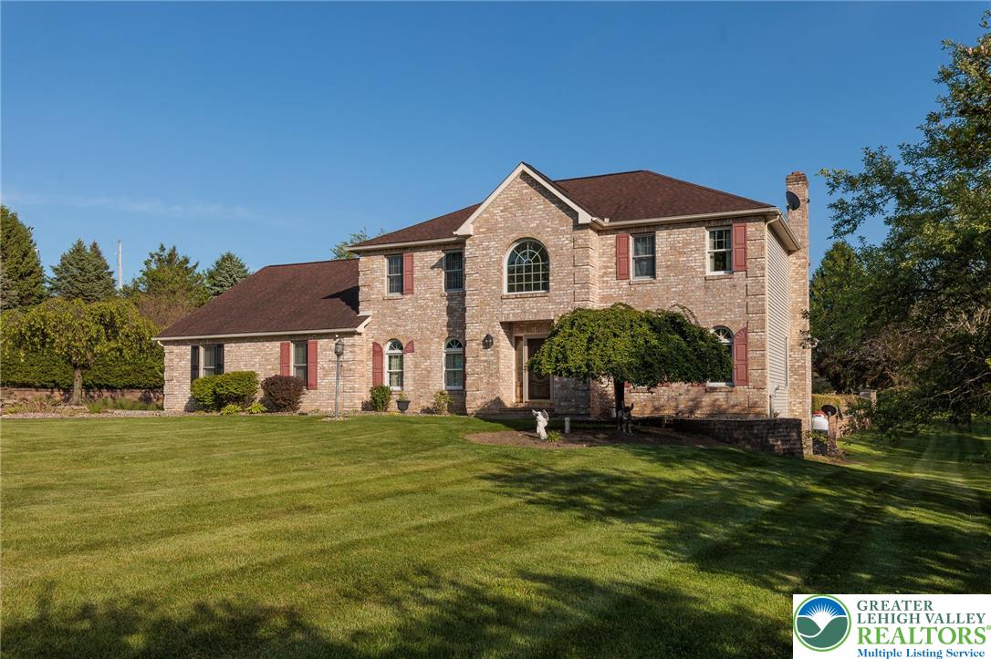 2170 Clearview Road Coplay, PA 18037 - Photo 73 of 75 This classic brick residence boasts a neatly manicured lawn and mature landscaping.