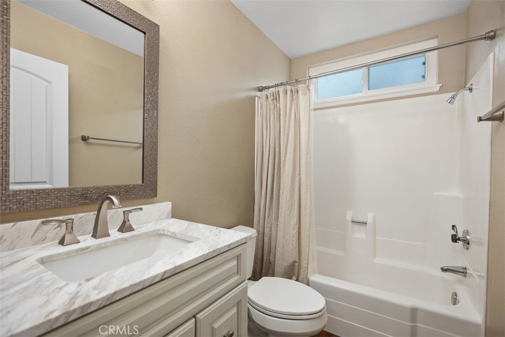 22182 Platino Mission Viejo, CA 92691 - Photo 10 of 18 a bathroom with a granite countertop sink toilet and shower