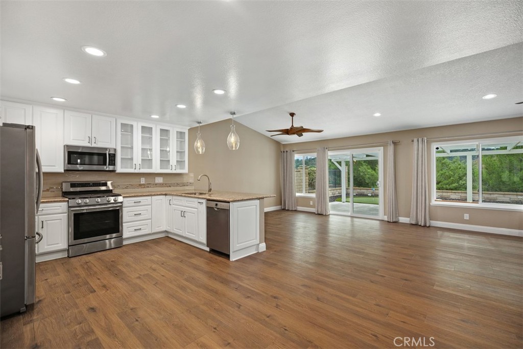 22182 Platino Mission Viejo, CA 92691 - Photo 18 of 18 a large kitchen with stainless steel appliances granite countertop a stove and a refrigerator