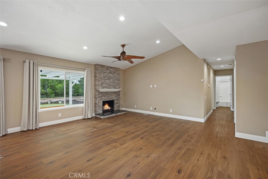 22182 Platino Mission Viejo, CA 92691 - Photo 4 of 18 a view of empty room with wooden floor and fireplace