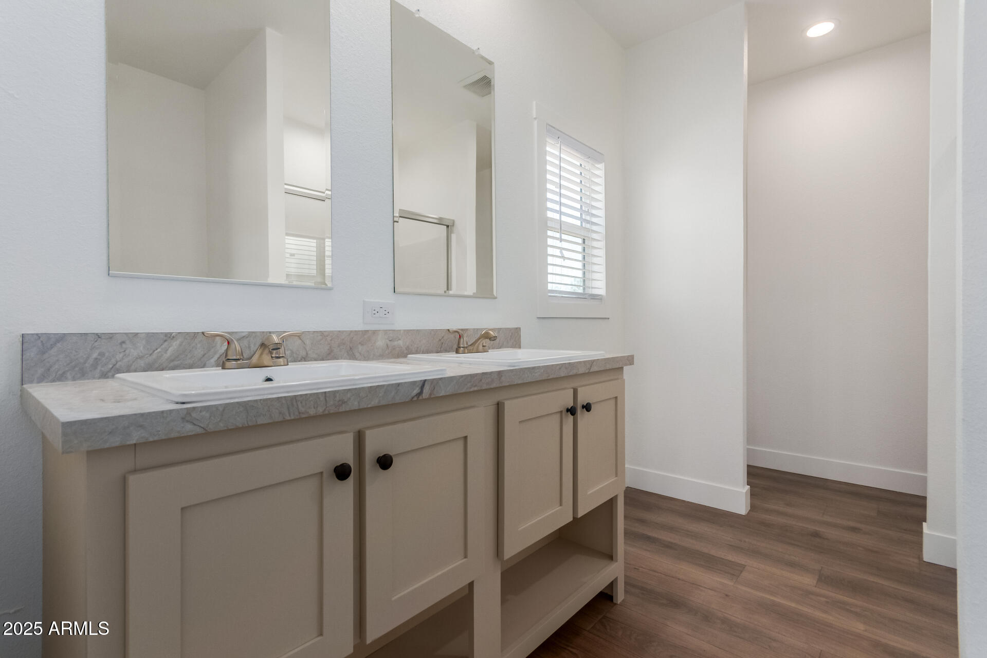 1246 North Ruby Road Maricopa, AZ 85139 - Photo 14 of 47 a bathroom with a sink and a mirror