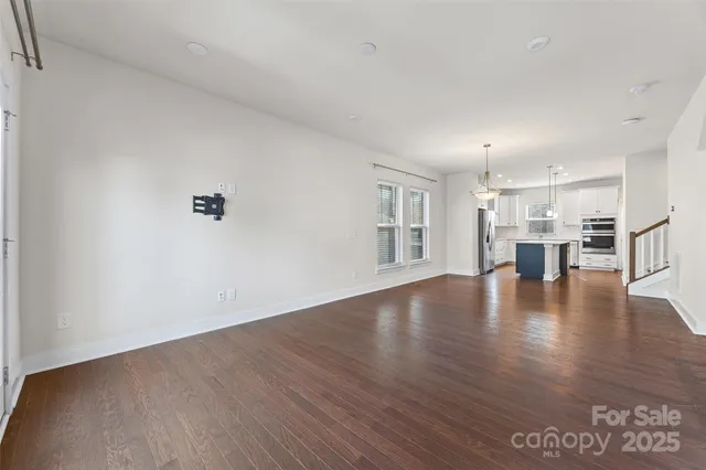 a view of a livingroom with wooden floor