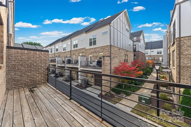 a view of a balcony with wooden floor