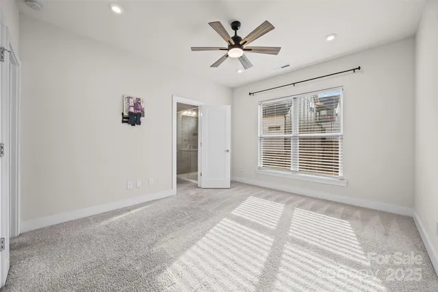 a view of a livingroom with a ceiling fan