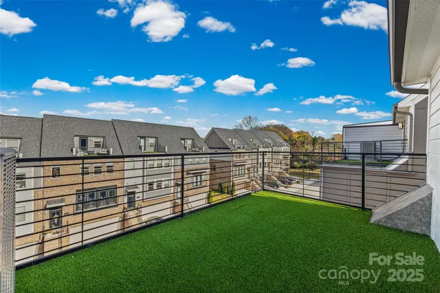 a view of a backyard with sitting area