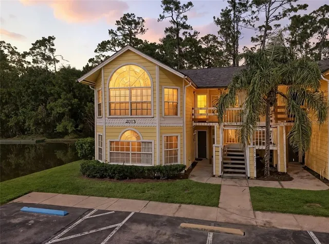 a view of a house with a yard