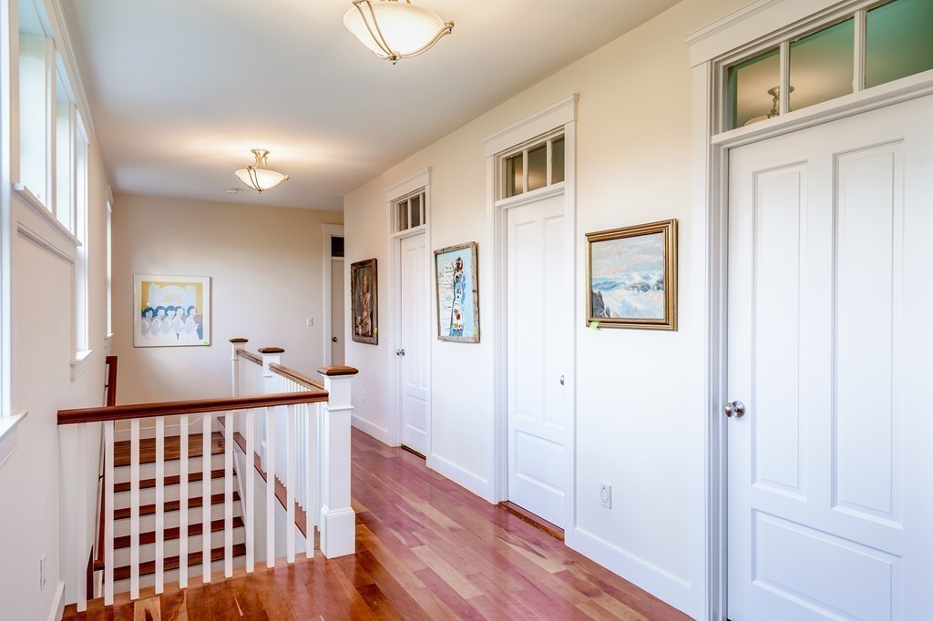 27 Old England Road Ipswich, MA 01938 - Photo 17 of 22 a view of a hallway with wooden floor and cabinet