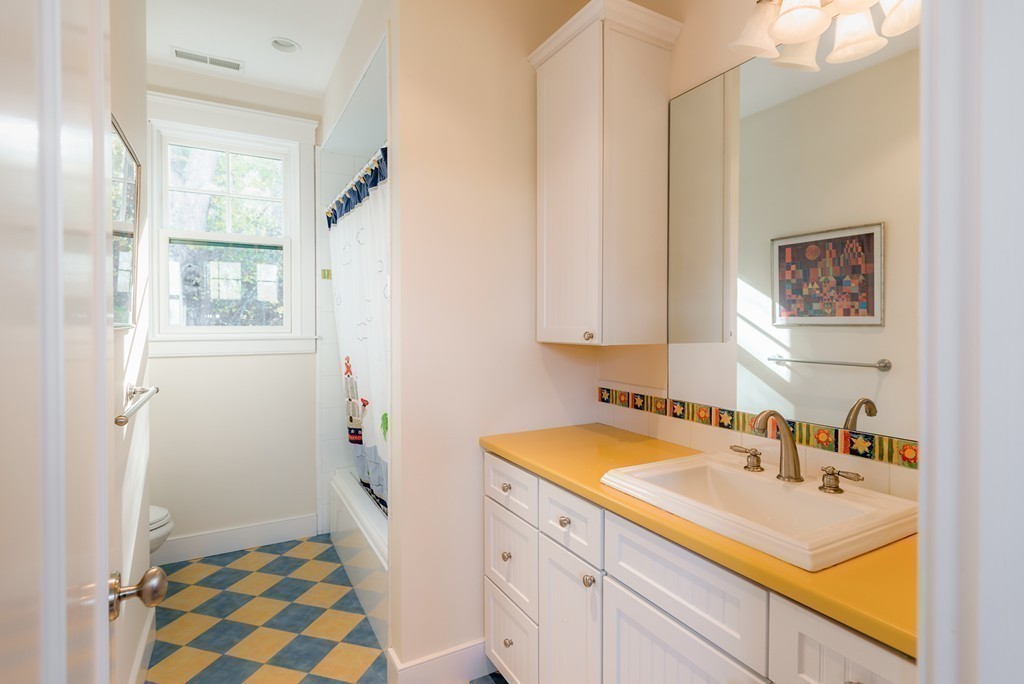 27 Old England Road Ipswich, MA 01938 - Photo 20 of 22 a bathroom with a sink and a mirror
