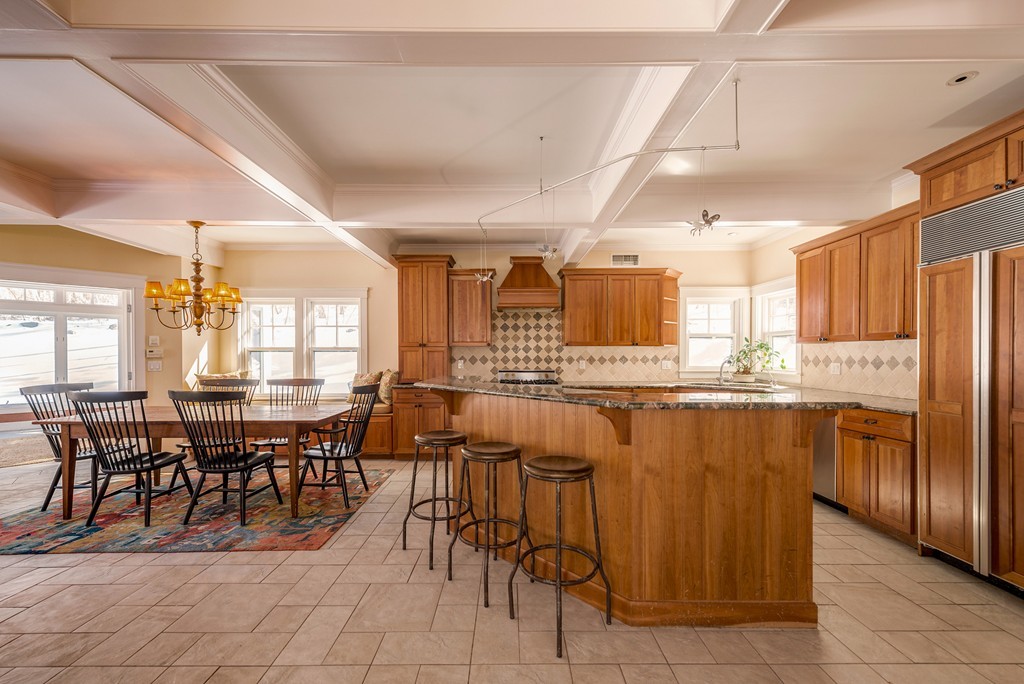 27 Old England Road Ipswich, MA 01938 - Photo 7 of 22 a dining hall with stainless steel appliances a dining table and chairs