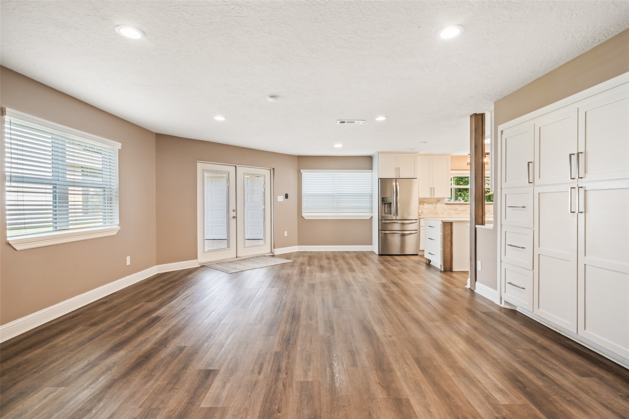3019 Ramblewood Road Montgomery, TX 77356 - Photo 11 of 40 A built-in pantry with deep drawers adds function and style to the dining area, offering smart storage for large kitchen essentials.