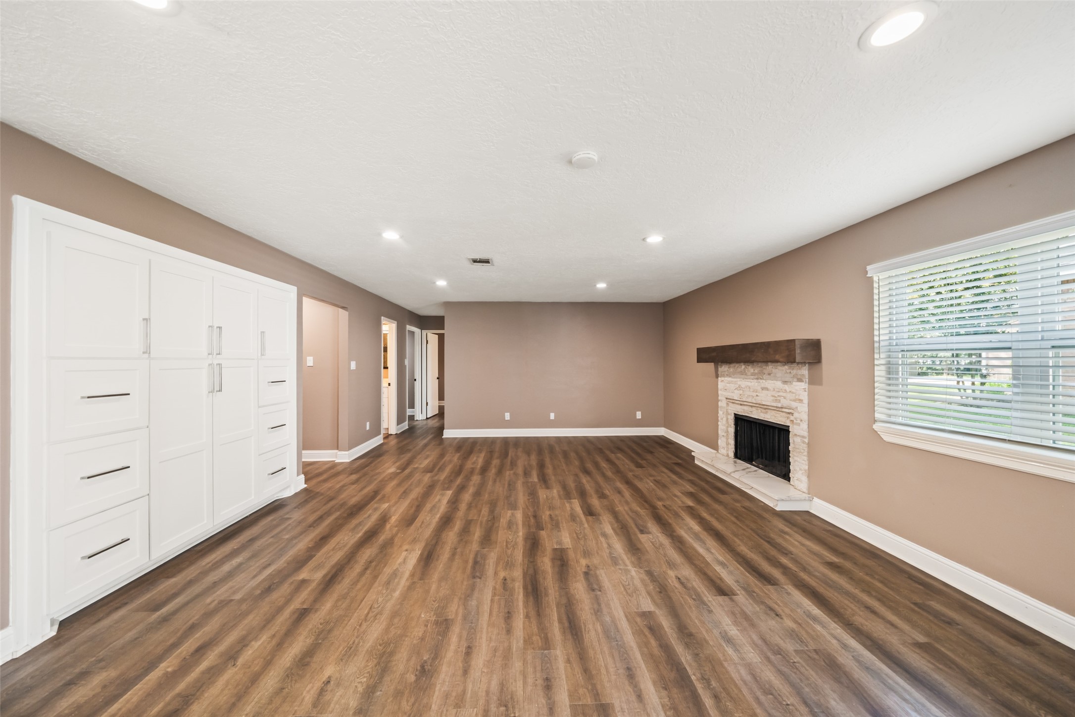 3019 Ramblewood Road Montgomery, TX 77356 - Photo 13 of 40 a view of empty room with wooden floor and fireplace