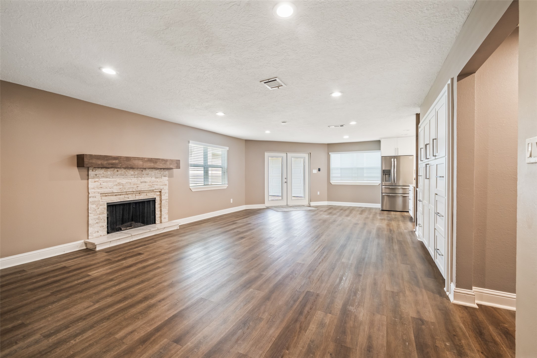 3019 Ramblewood Road Montgomery, TX 77356 - Photo 14 of 40 a view of a room with wooden floor and fireplace
