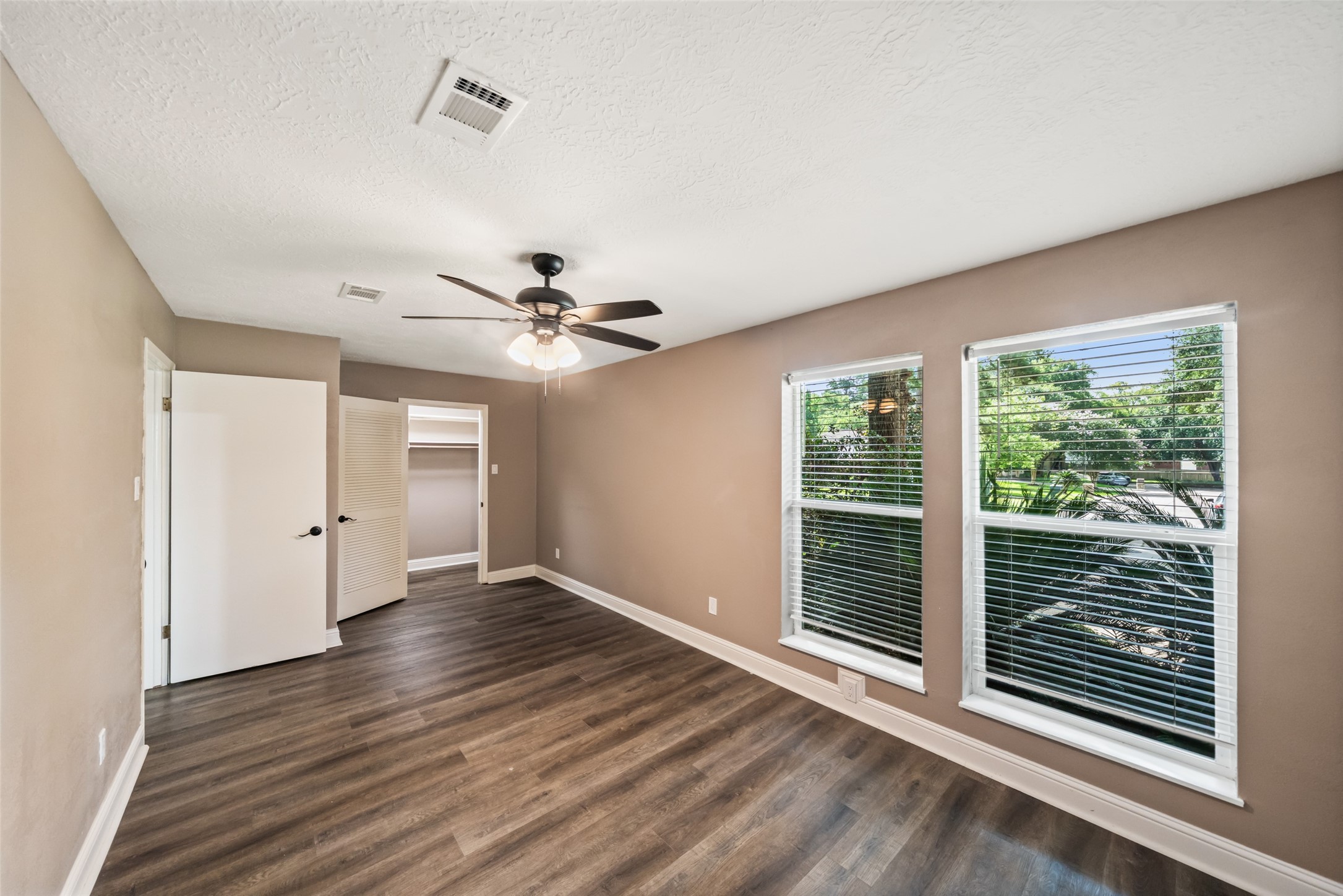 3019 Ramblewood Road Montgomery, TX 77356 - Photo 22 of 40 a view of an empty room with wooden floor and a window