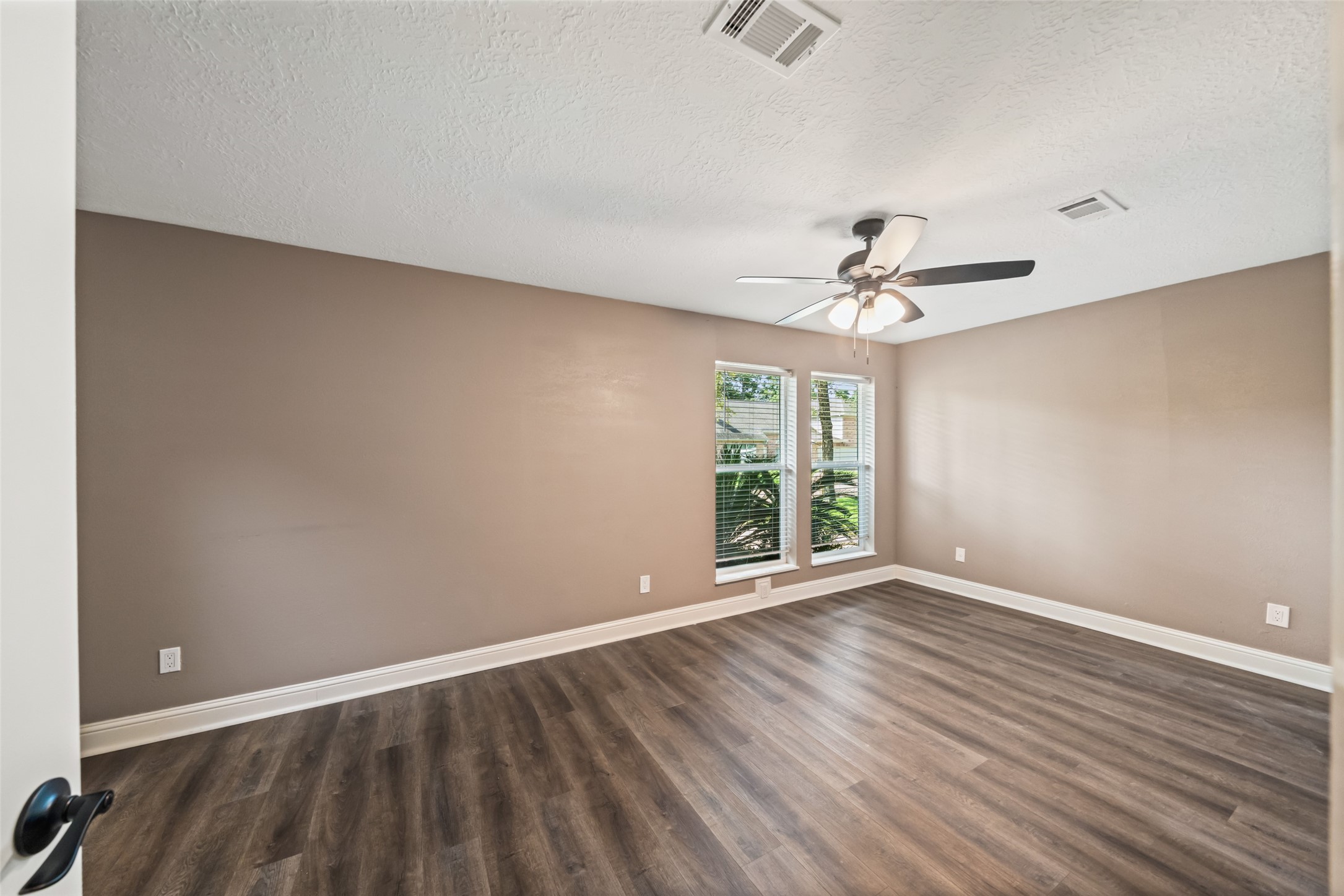 3019 Ramblewood Road Montgomery, TX 77356 - Photo 23 of 40 wooden floor in an empty room with a window