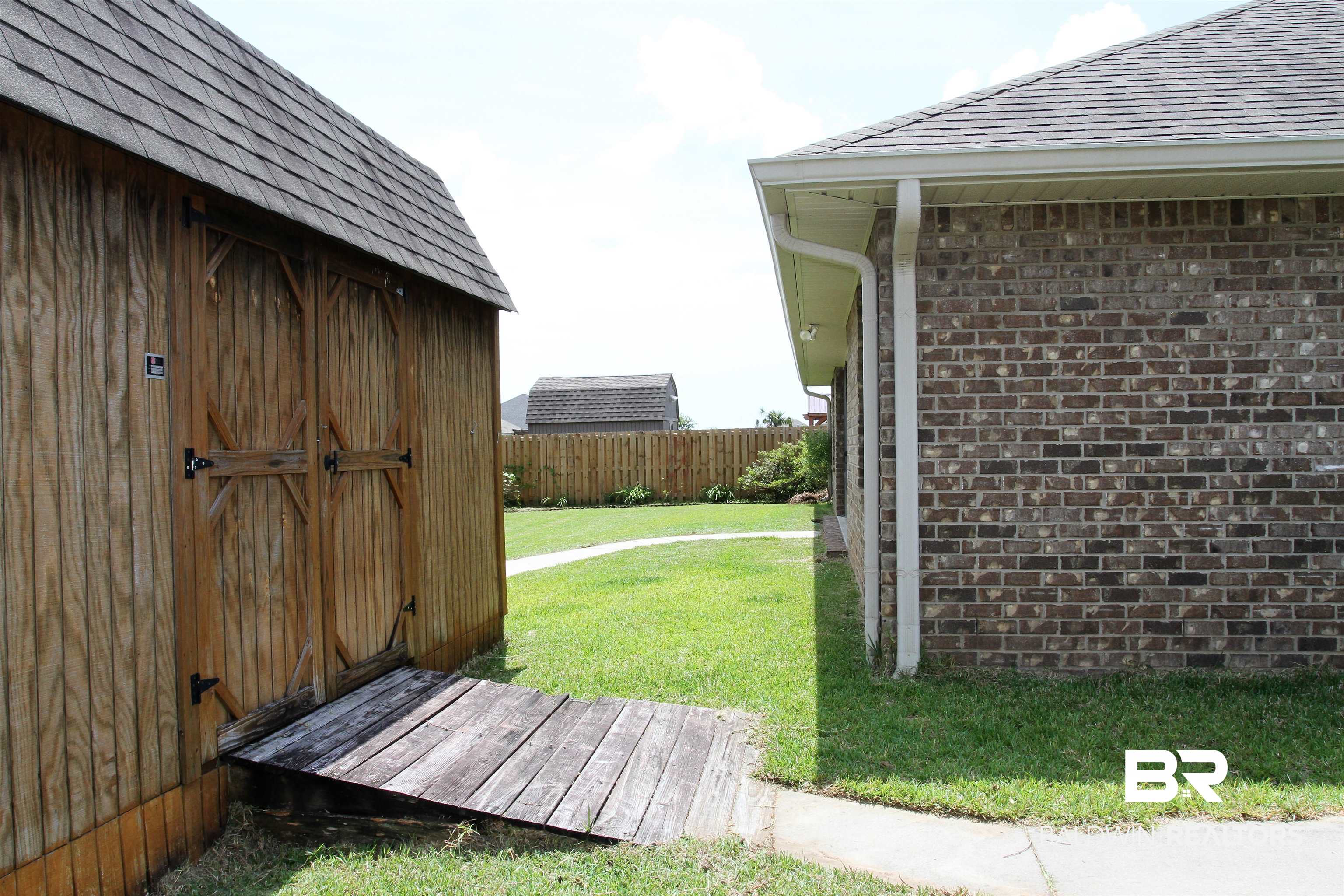 14620 Silvermere Drive Foley, AL 36535 - Photo 21 of 27 View from side of shed down backside of house.