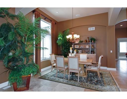 22207 Carmack Road Marengo, IL 60152 - Photo 4 of 16 a view of a dining room with furniture window and wooden floor