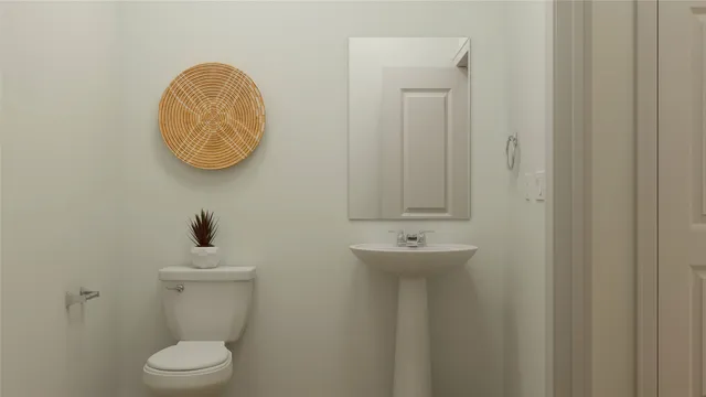 a bathroom with a toilet and a sink