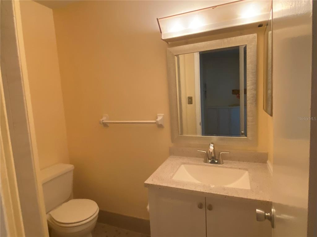 1500 Gay Road, Unit 17D Winter Park, FL 32789 - Photo 21 of 34 a bathroom with a sink toilet and mirror