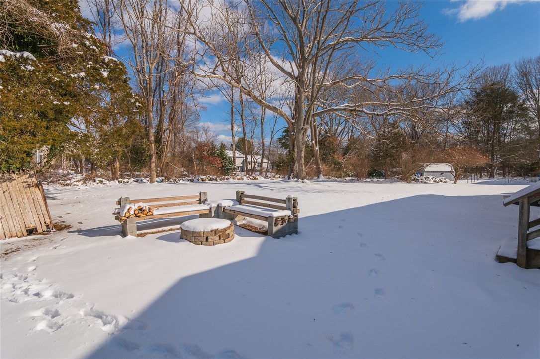 711 S Road South Kingstown, RI 02879 - Photo 29 of 32 Backyard fire pit area and wood shed