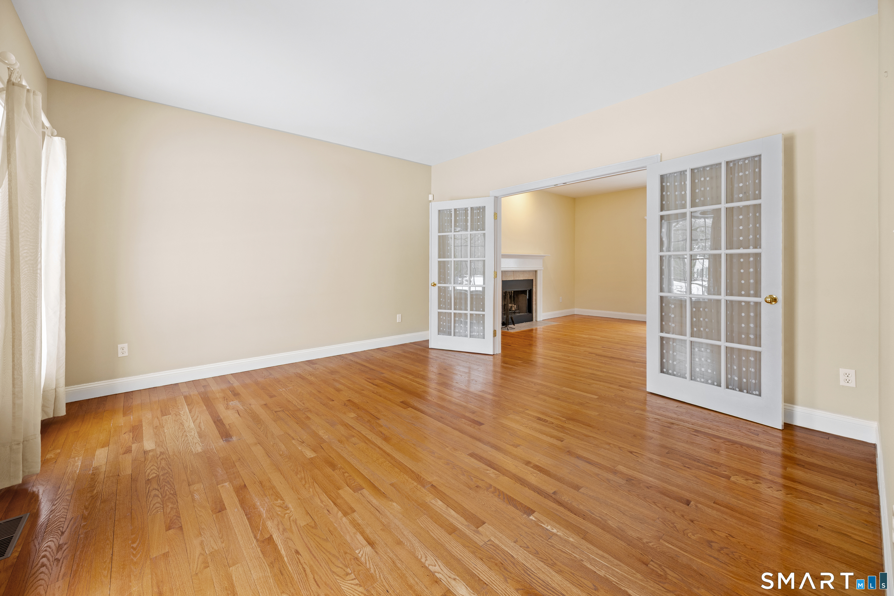 11 Nature Trail Hamden, CT 06518 - Photo 12 of 28 an empty room with wooden floor and windows