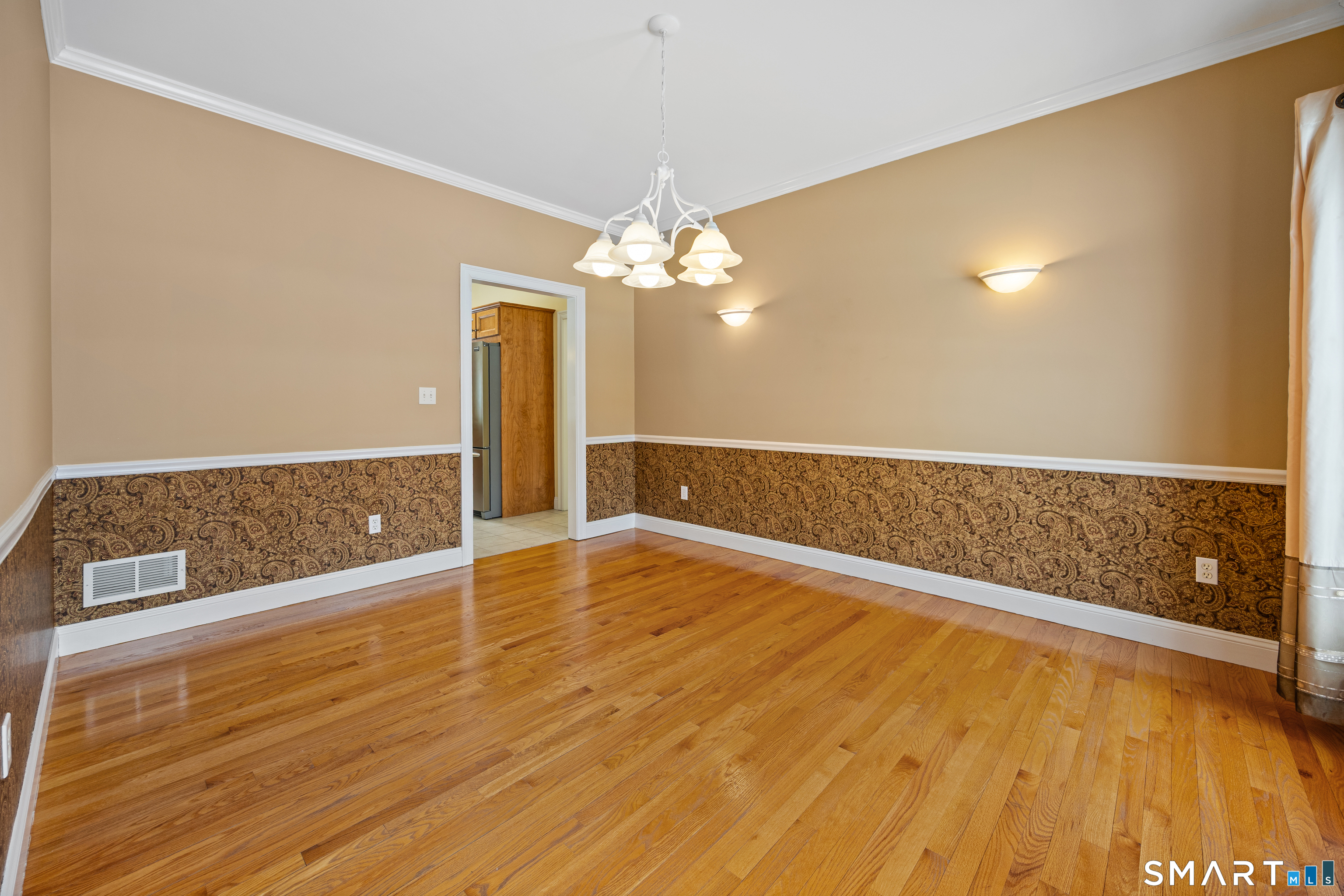 11 Nature Trail Hamden, CT 06518 - Photo 14 of 28 a view of an empty room with window and wooden floor