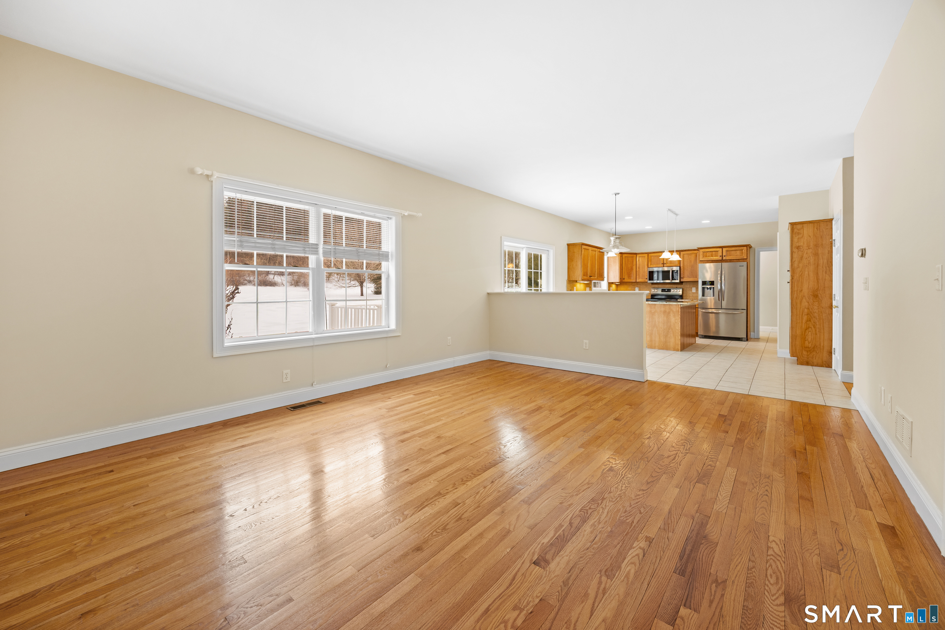 11 Nature Trail Hamden, CT 06518 - Photo 18 of 34 an empty room with wooden floor and windows