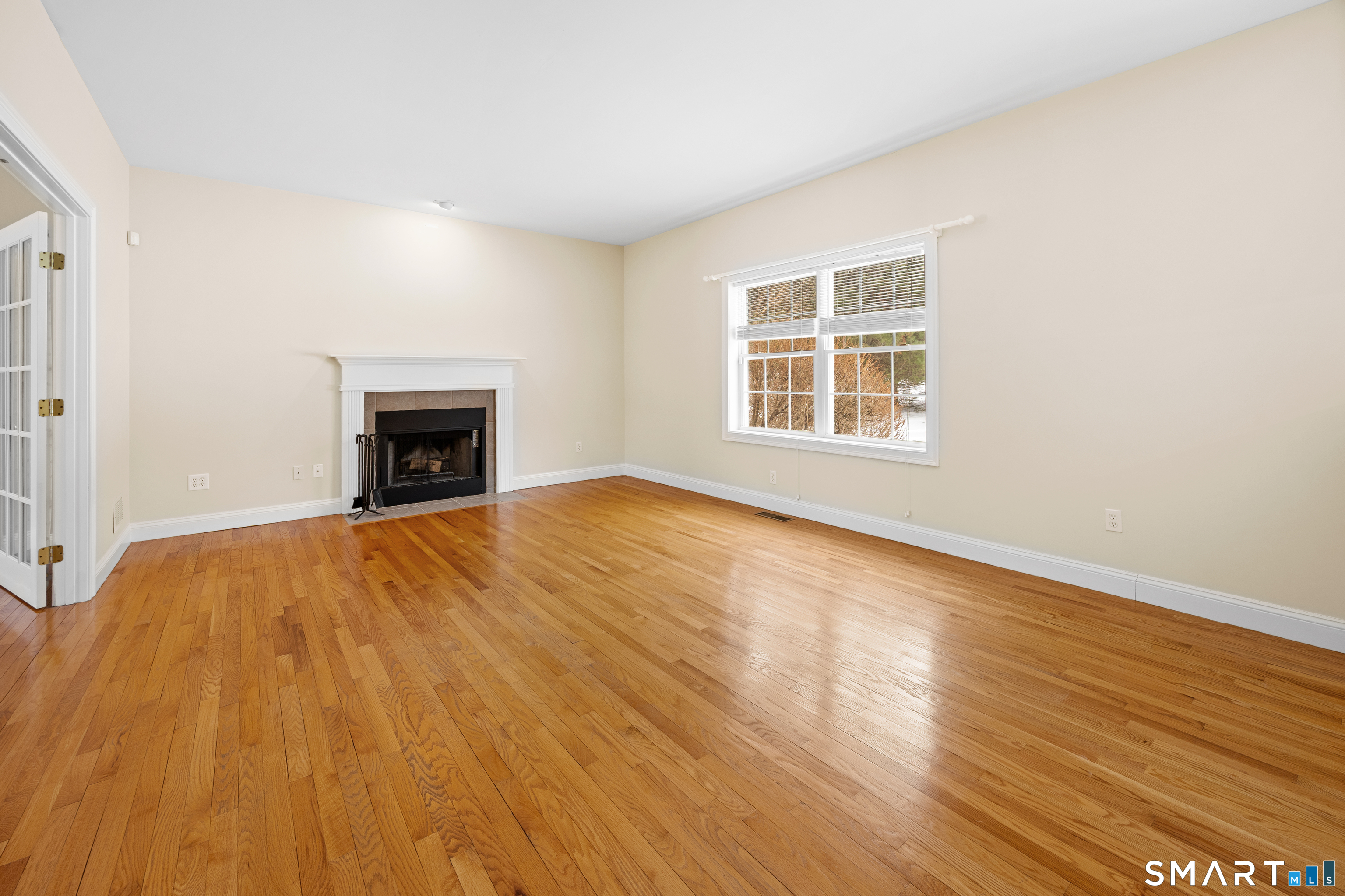 11 Nature Trail Hamden, CT 06518 - Photo 19 of 34 a view of empty room with wooden floor and a window