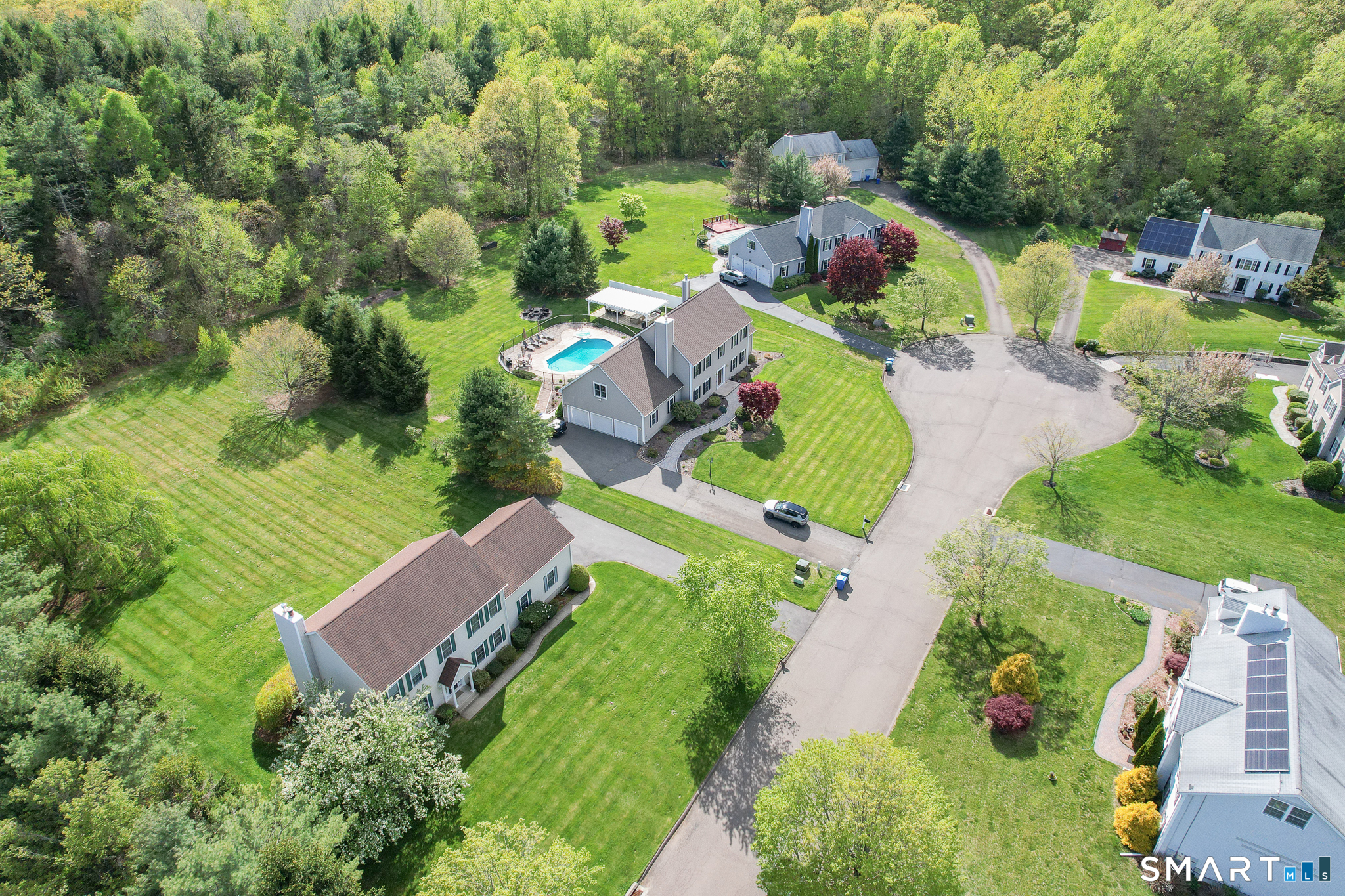 11 Nature Trail Hamden, CT 06518 - Photo 2 of 34 an aerial view of a house with a garden and swimming pool