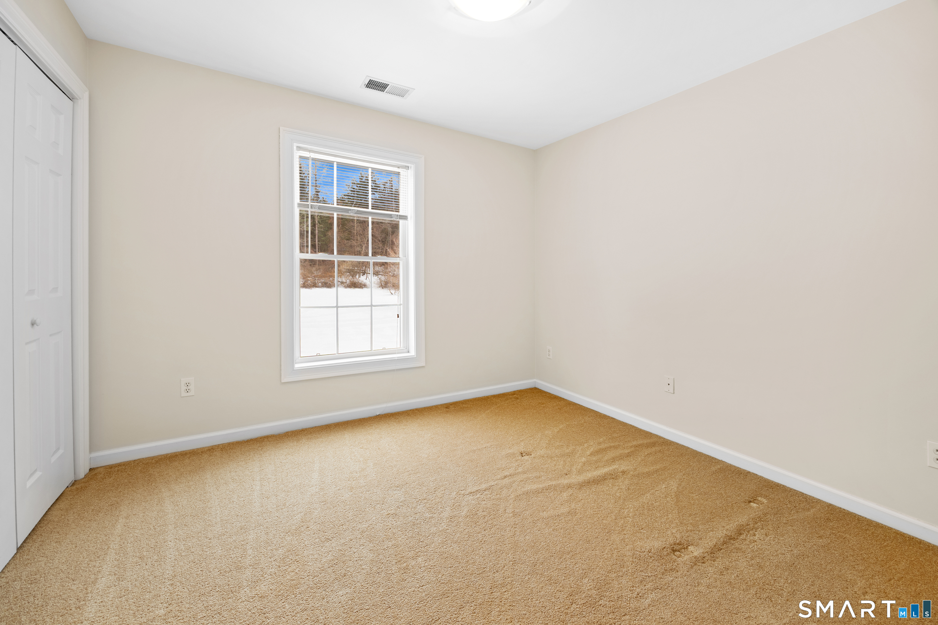 11 Nature Trail Hamden, CT 06518 - Photo 21 of 28 a view of an empty room with a window
