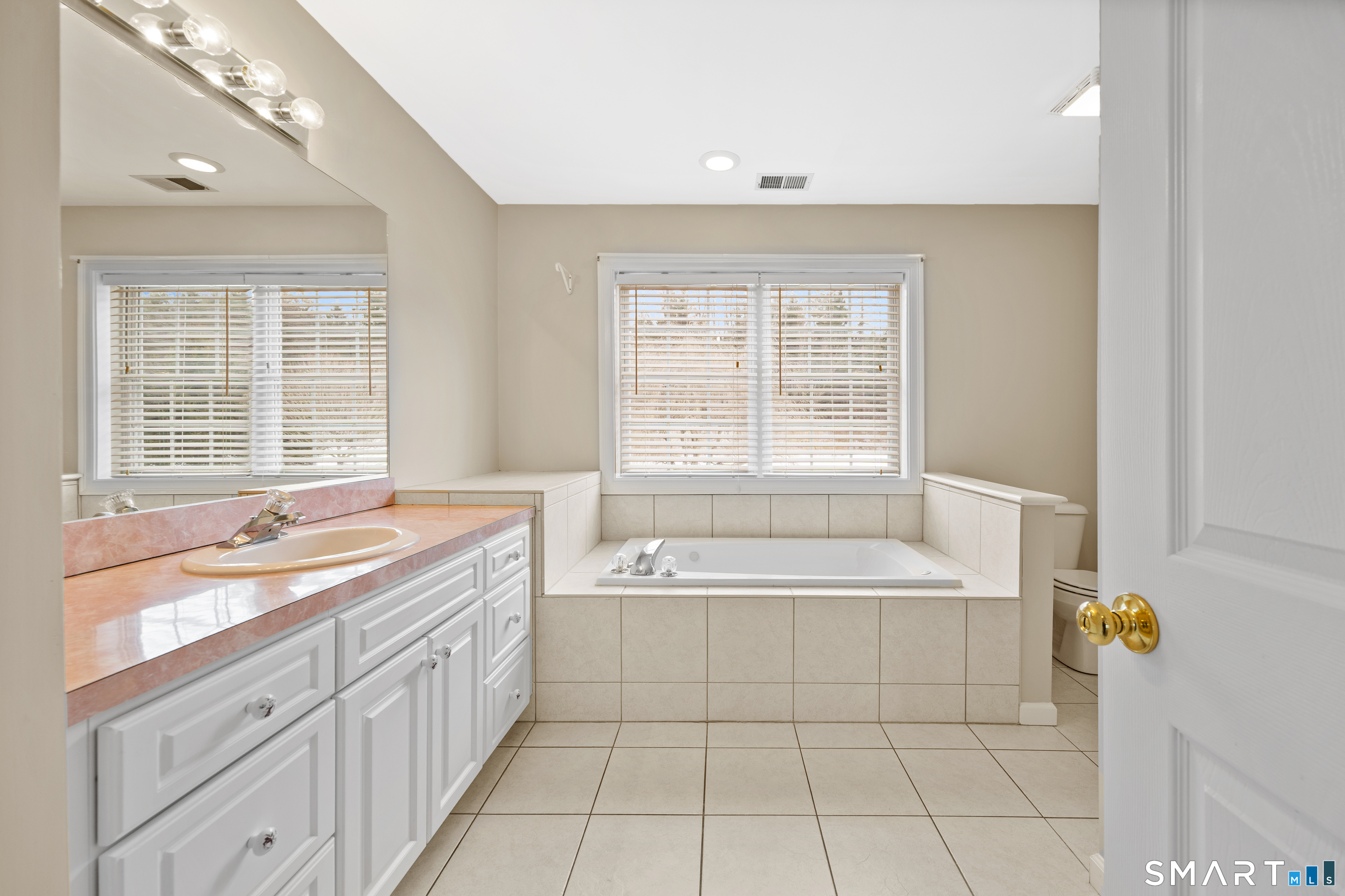 11 Nature Trail Hamden, CT 06518 - Photo 25 of 34 a spacious bathroom with a tub sink and mirror