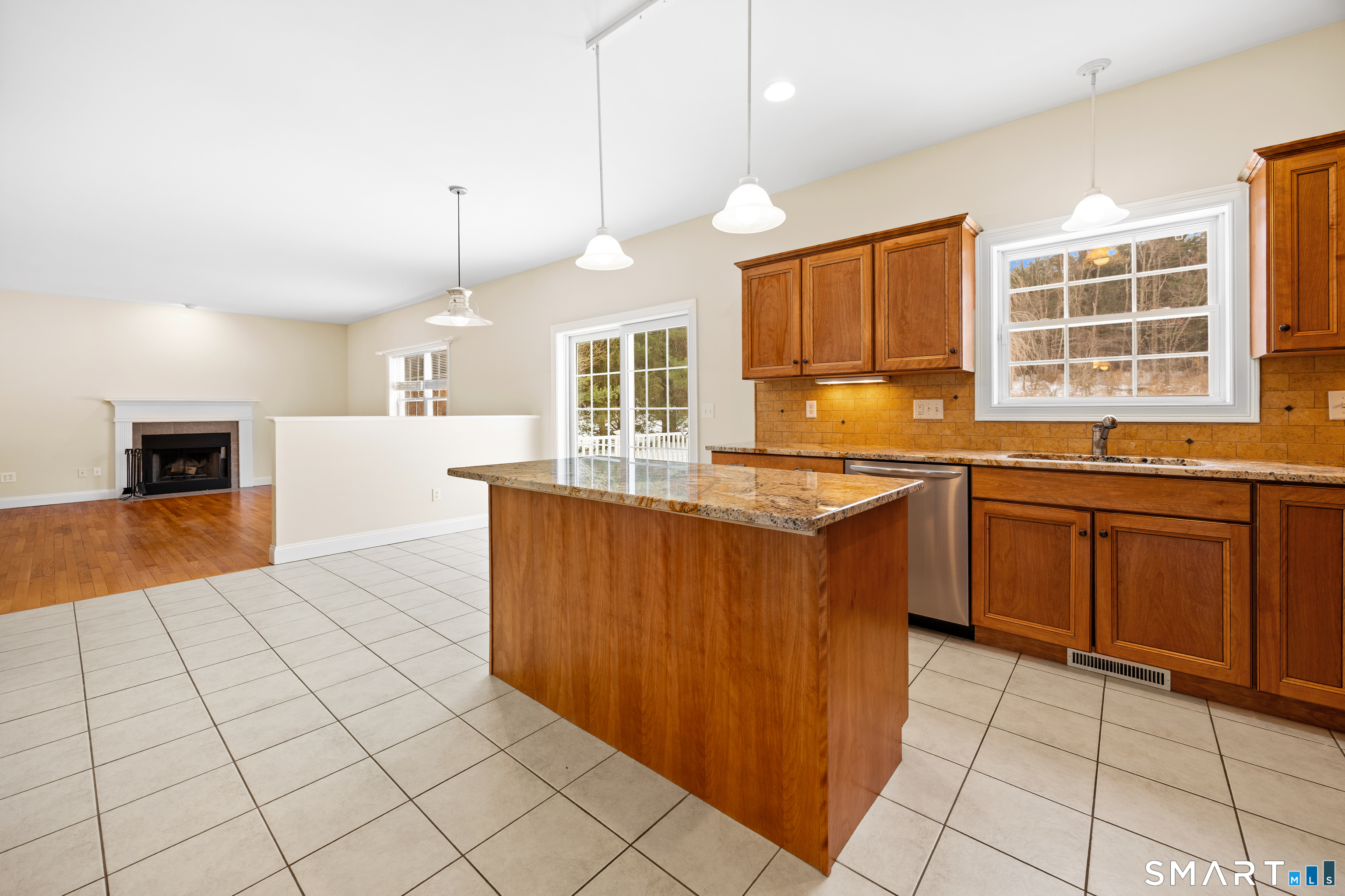 11 Nature Trail Hamden, CT 06518 - Photo 8 of 28 a kitchen with stainless steel appliances granite countertop a sink a stove and a wooden cabinets