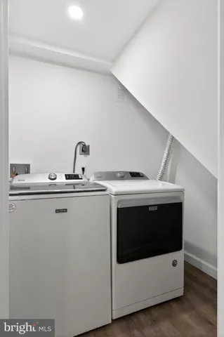 a utility room with dryer and washer