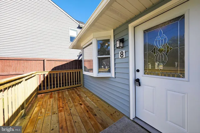 a view of balcony with wooden floor