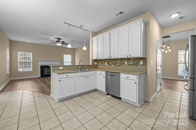 a kitchen with a cabinets and appliances